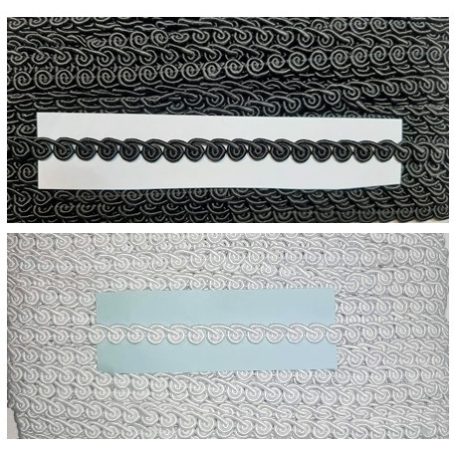 Díszítő szalag 10 mm széles, "csiga" minta, fehér vagy fekete színben.  25  méteres