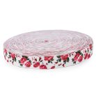 Gumiszalag 30 mm mintás fehér alapon rózsa mintás. 85% poliészter, 15% elasztán.  2 métertől 