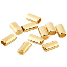  Ovális alakú fém, zsinórvég díszítő,  8x14 mm arany vagy ezüst 100 db / csomag  . Az egyik oldalon kisebb a lyuk!